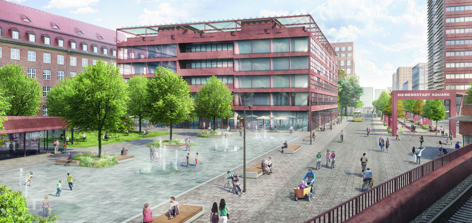 Blick vom S-Bahnhof über den neu gestalteten Eingangsbereich mit Wasserspielen und Grünflächen auf das Tor zur „Siemens-Galerie“, die in den Boulevard übergeht und in Siemensstadt Square hineinführt.