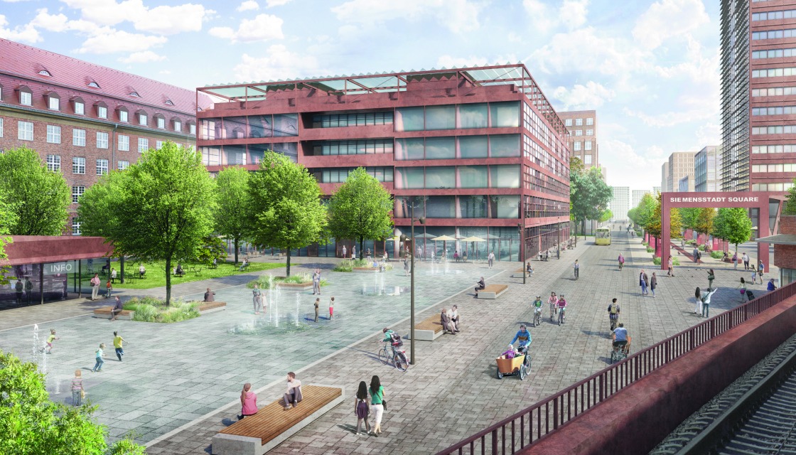 Blick vom S-Bahnhof über den neu gestalteten Eingangsbereich mit Wasserspielen und Grünflächen auf das Tor zur „Siemens-Galerie“, die in den Boulevard übergeht und in Siemensstadt Square hineinführt.